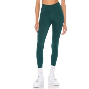 Nike One Luxe mid-rise leggings in size Small